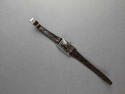 an image of a watch on a table with a white background