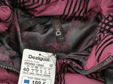 the jacket is pink and black with a zebra print on it