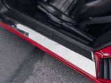 a close up of a red car with its doors open