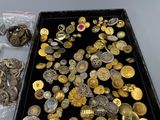 a black box filled with lots of gold and silver coins