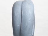 a blue vase sitting on top of a white pedestal