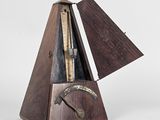 une image représentant un instrument de musique doté d'un corps en bois et d'un manche en métal