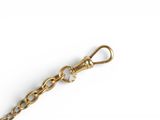 gold plated key chain with a heart shaped clasp on a white background
