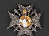 a close up of a badge on a black surface