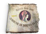 an old flag with a picture of a woman on it