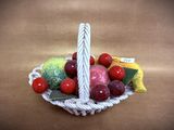 a basket of fruit and vegetables sitting on a table