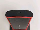 a close up of a cell phone on a stand