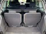 two seats in the back of a car with the trunk open