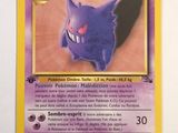 a close up of a pokemon card on a white surface