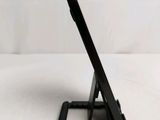 a tablet that is sitting on a stand on a table