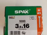 a box of screws on a white surface