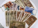 a white plate with many different bills on it