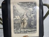 a picture of a woman holding a book on a chair