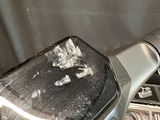a close up of a motorcycle handlebar with a black cover on it