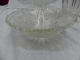 a glass bowl on a table with a white table cloth