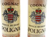 two bottles of wine are sitting side by side on a white surface