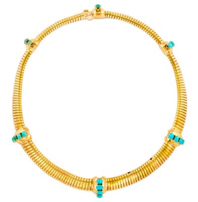 un collier en or orné de pierres turquoise