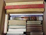 a box full of books sitting on top of a table