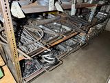 many different types of metal parts in this room
