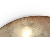 a large metal bowl sitting on top of a table