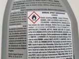 a close up of a bottle of liquid on a table