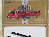a red fire truck and a red firetruck in a box