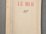 the cover of the book le mur is shown on a gray surface