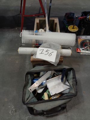 a bag with a bunch of items in it on the floor