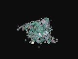 a close up of a pile of broken glass on a black background