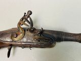 an old gun with a man on top of it