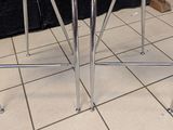 two stools that are sitting on a tiled floor