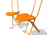 pair of orange folding chairs against a white background