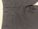 the back of a gray suit with a buttoned collar and cuffs