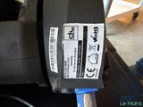 a sticker on the back of a motorcycle with a blue handle