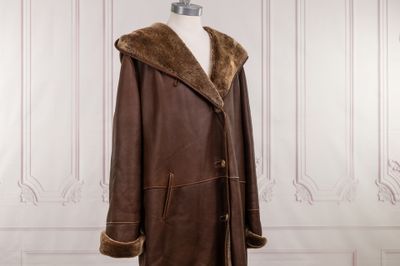 an image of a brown leather coat on a mannequin mannequin