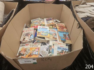 a cardboard box full of books sitting on the floor