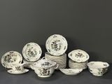 a group of porcelain dishes and cups and saucers
