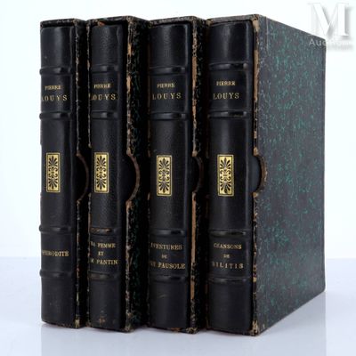 three books are stacked on top of each other on a white surface