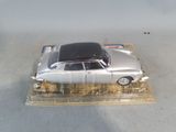 a toy car that is sitting on top of a plastic tray