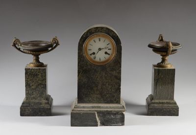 three pieces of marble with a clock on each of them