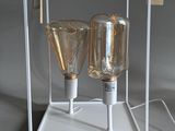 two lamps that are sitting in a clear box