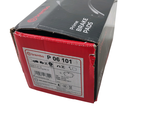a red box with a black and white label on it
