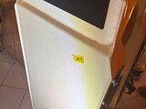 a refrigerator that is sitting in the corner of a room