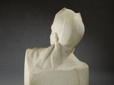 marble bust of a woman with a hat on her head