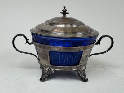 an antique silver and blue glass covered bowl with handles