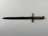 a close up of a knife with a wooden handle on a white surface