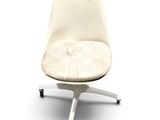 a white chair with a seat that has a cushion on it
