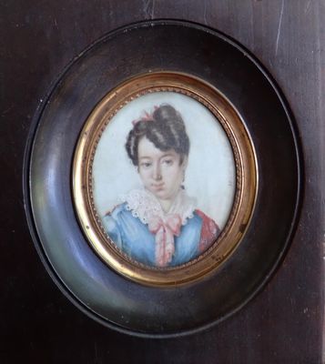 a picture of a woman in a blue dress in a gold frame