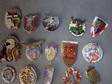 a lot of badges that are on a table