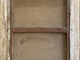 an old window with a wooden frame on the outside